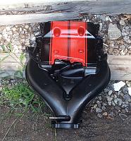 Powder coated LLT intake with inferno orange stripes.