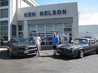 My Son and I piciking up My First 2010 Cyber Gray 2SS/RS Camaro with My 1980 Blown Camaro that I bought Brand New in 1980. 30,000 orig. Miles, Orig. Paint, Orig. Interior. 
Quite the coin toss on who...